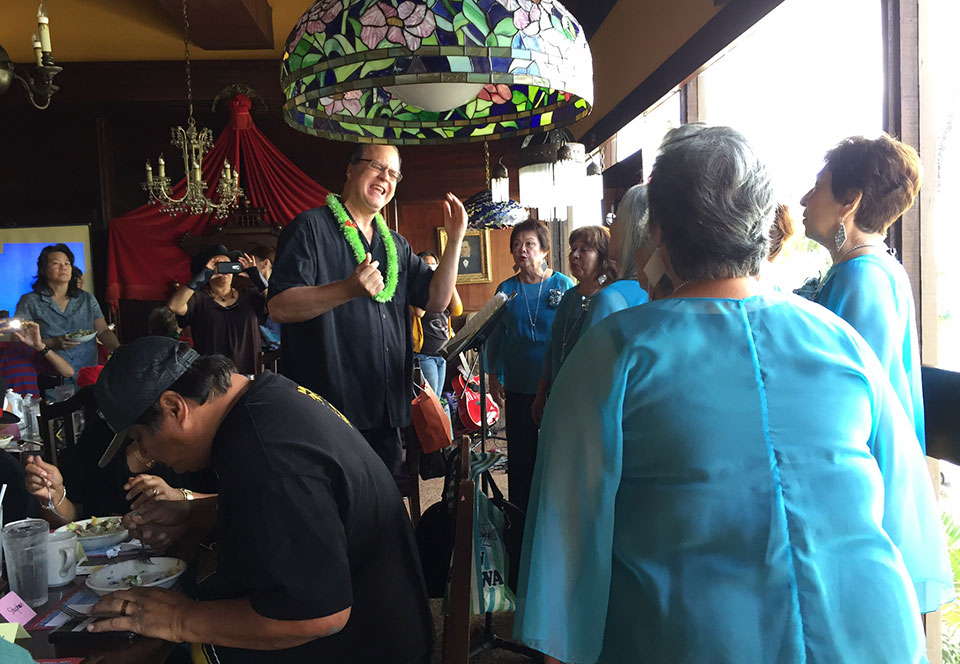 image of Na Leo Lani Chorus singing at Mad Hatter event